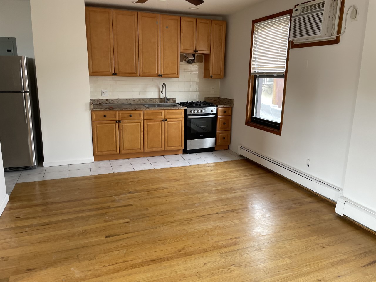 Spacious & Cozy 2nd Floor 2 Bedroom Apartment For Rent; Features Living Room/Kitchen Open Concept, and 1 Full Bath. Hardwood Floors And Plenty Of Closets Throughout. Rent Includes Heat And Water; Tenant Responsible For Gas And Electric. Conveniently Located Near Shops And School.