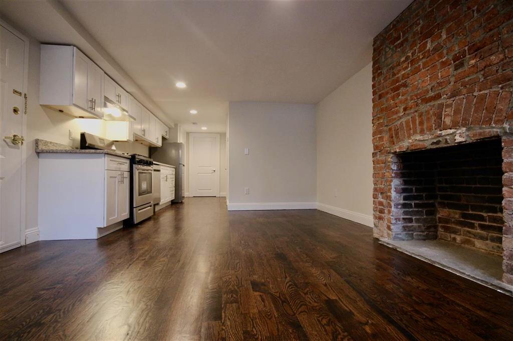 Move into this recently renovated midtown Hoboken 1 bedroom rental located close to the Hoboken waterfront. Features: rich cherry oak hardwood floors throughout, open kitchen with stainless steel appliances, granite counters, subway tile backsplash, living room, separate bedroom with closet, full bathroom with tub, private washer / dryer, exposed brick, crown molding, GARDEN LEVEL (street level), common yard, 2 blocks off of the Washington Street, close to restaurants, shopping, the Hoboken waterfront, parks, pubs, and public transportation to NYC and other parts. Tenants pay their own utilities. AVAILABLE OCTOBER 5th. NO PETS. Street parking. To make this apartment yours: $2450 (1st months rent), $3675 (security deposit), $2450 65 (credit check per adult). 