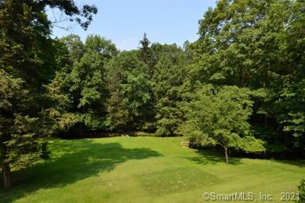 Beautiful 2 acre lot with meadow and gently flowing stream. Close to town on West Side location. Access to property from Welles Lane.