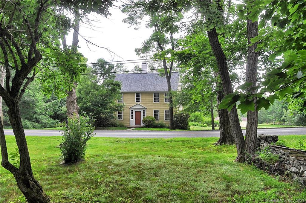 Beautiful vintage home on a stretch of Middle Road Turnpike surrounded by similar distinguished homes. A stately colonial with room for all and expansion possibilities with a potential building lot across the street. Offering all the amenities one can expect from a antique including gorgeous wideboard floors, four fireplaces, many built ins and all the character one can expect from an older home. The first floor provides a formal dining and living room, a kitchen opening to a large family room with huge walk in fireplace with bee hive oven, a main floor office and a cozy screened in porch. The upper floor accessed by either the front or back staircase offers the same hardwood floors, two full baths, two attics, and four good sized bedrooms. An awesome plot of level land that could be terrific horse property, farmland or just play area for all to enjoy. Many outside features including stone walls, a bluestone patio overlooking all the property, a two car garage with attached shed and a pond in the rear of the property. Many possibilities including a potential lot split and a separate .87 lot of record across the street.