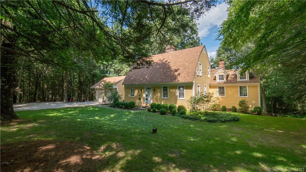 The country home you have been searching for! Historic meets chic in this stunning one of a kind bow house. Tucked on a quiet country road just one mile from Woodbury center, this home's unique features are testaments to quality craftsmanship of bygone days including paneled and wainscoted walls, hand forged hinges and hardware, exposed beams, wideboard floors, pocket doors, true divided light wavy glass windows and built-ins galore. Built in 1986, with a addition in 1993, this home's open and flexible floor plan offers endless options for living, entertaining and home office. A gracious enclosed porch welcomes you home and offers the perfect setting for casual relaxation. The country kitchen features a large bay window, granite island and built in hutch. Access the home's upper level from two staircases to find a large master suite and second en suite bedroom plus a dramatic third bedroom (or artist loft!) overlooking the backyard gardens. A large addition on the back of the home offers additional space for entertaining or relaxing, with french doors opening to the lovely new cedar deck. The spacious lower level offers a full bath and three additional rooms -a perfect space for guests, in-law, or au pair and has private walk out to the back yard. Roof is two years young and the exterior has just been repainted. This elegant home is the real deal and located just 90 minutes from NYC in the town Reader's Digest named the most charming small town in Connecticut.