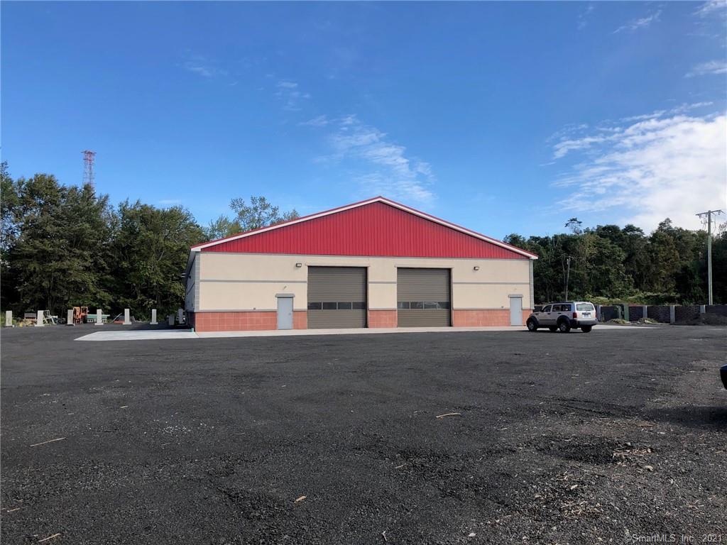 Great opportunity to purchase a 13, 600 sq. foot NEW commercial building. High visibility Amity rd. Rt-63 It is currently divided up into individual rentable bays from 2400- 3000 sq. ft. each with separate utilities and a bathroom with and without office. Ceiling Hight is approx. 16.9 ft overhead doors are 14 ft. Larger unit has a 20x20 finished office space. Large level yard will be graded and millings put down. Could be used for retail sale of earth materials. Owner will lease back a portion of the building .Building completion soon.