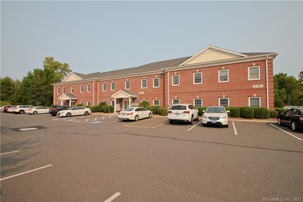 Commercial office building located in the center of Suffield. Low-maintenance brick building built in 2006 with 22, 104 sq. ft. with three floors of office space. Currently 90% occupied. Three separate entrances. Elevator, two stairwells, twelve restrooms, gas heat, central air, security system, ADA compliant. Set on 2.21 acres with a large parking lot. Great convenient location with high visibility - close to local area businesses including restaurants, town offices, banks, retail stores I-91 and Bradley airport. Income and expenses available.