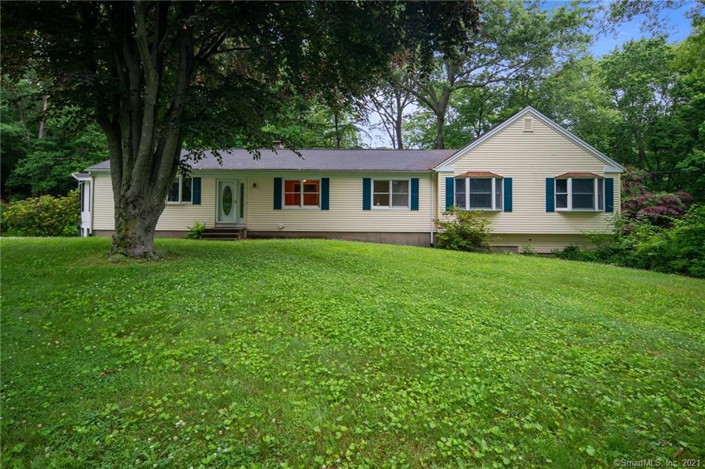 Welcome home to 12 Hard Hill Road, Woodbury, Come see what one-level living is really like, you will love the openness of this beautiful updated kitchen and dining room with a floor-to-ceiling brick fireplace.Over 2, 500 sq/ft. Gleaming Hardwood floors thru-out the first floor, including the 4 large Bedrooms !! The lower level has a Large Family room with another floor-to-ceiling brick fireplace, and a slider out to the rear yard. The lower level also has a bonus room great for the kids or office space and a 2-Car garage, Nice professionally landscaped level grounds. A home to be proud of in beautiful Woodbury.