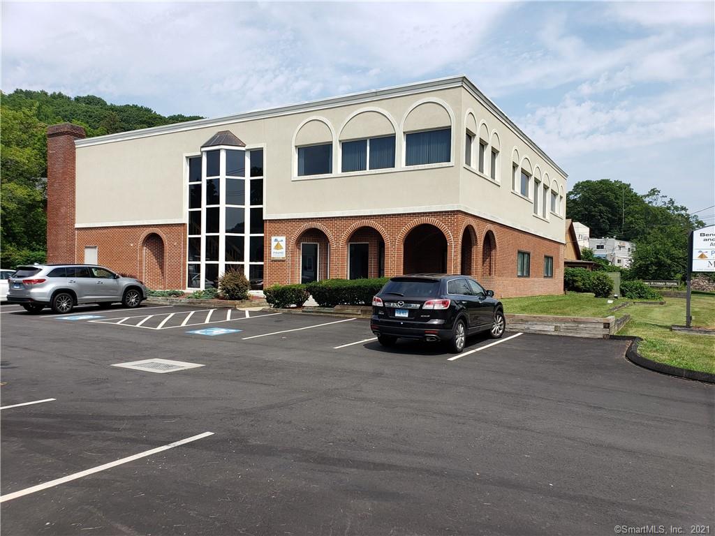 Ideal set up for someone that needs an office. Utilities provided. Individual office space and conference rooms are available Building is located on Whitney Ave close to Quinnipiac University. Large off street paved parking area,  Call agent for more information or showings.