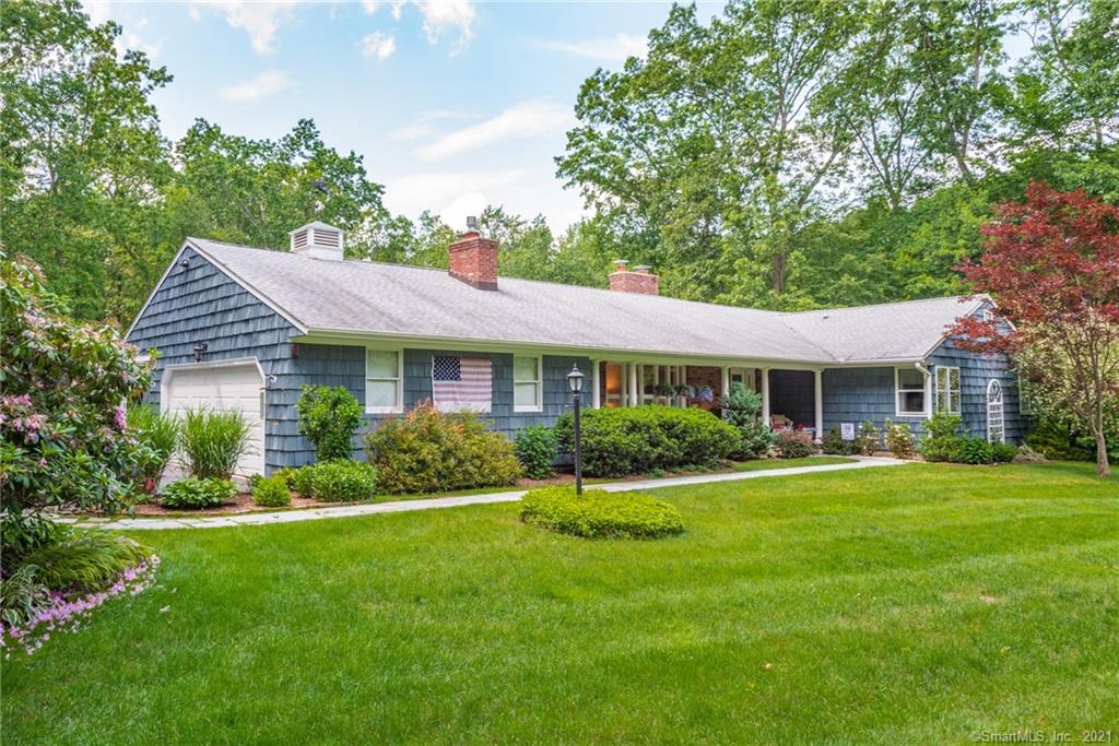 Stunning complete interior renovation at this unique 2800 sq/ft ranch on 5+ acres. From the welcoming foyer one steps into a spacious and comfortable living room with gas fireplace and a large bay window. The living room is open to the eat-in kitchen with its long center island which includes an LP gas cooktop. Cream colored cabinets, gorgeous leathered granite counters and stainless steel appliances compliment the ample storage and work space found here, a chefs delight! Off the other end of the kitchen is the glorious Great Room---a large space with a vaulted ceiling, surrounded by windows that offers a seating area adjacent to a wood stove and a dining area with room for lots of guests. To the side is a traditional 3 season room with shiplap ceiling and walls. One can also step out to a plus sized deck with tranquil views of the yard and woods. The master suite features a walk-in closet and a stylish bath with huge shower as well as a deep soaking tub. The 2nd and 3rd bedrooms share another recently remodeled bath with shower. Just off the attached 2 car garage is a handy mud room with lovely tile, a sink and closet. The full basement is is enormous and offers plenty of storage and added finished space potential. All this on a quiet cut-de-sac just two miles from the center of town!