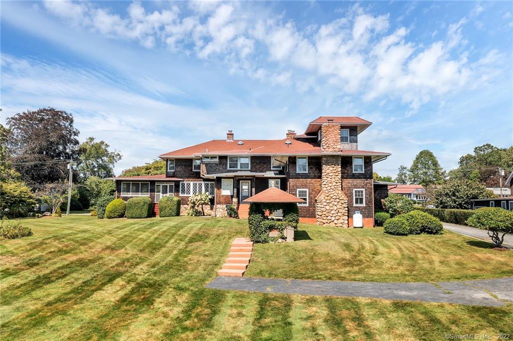 This 6, 800 square foot, private family home, based on a Frank Lloyd Wright design, is perfect for multi-family seaside vacations. The home is two blocks from Eastern Point Beach in Groton. The entire home will be yours to enjoy--eight separate sleeping areas, six bathrooms, and regal living spaces. This house, like many in the area, was the former seaside retreat of a wealthy family.The Space:This very large, newly furnished home has spaces for everyone to gather as a group or for quiet conversations on the side. The home includes a Grand Game Room,  featuring a pool table, big-screen TV,  a table for board games and a small adjoining video gaming area. On the front side of the home, you will find a large living room, a separate TV room, and a large semi-formal dining room. Just off the dining room and next to the outdoor barbeque, you can enjoy a pleasant breeze in the large, screened porch with a view of Ledge Lighthouse. The kitchen is flanked by a walk-in pantry and an additional eating area for 8-10 people. All bedrooms are located on the second floor and are furnished with new mattresses. Three of the bedrooms near the grand, center staircase contain king beds with Avocado brand mattresses. All bedrooms have new blackout blinds. Above the Grand Game Room, you will find an apartment with a queen size bed, a separate bedroom with two twin beds, a kitchenette, a full bathroom, and a separate eating/TV area--perfect for a family of four.