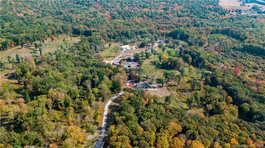 This is the Original Firefly Farm of 135 acres. It was once a YMCA camp, currently the home of Rare Breed free ranged Mulefoot Hogs, a 90% FDA approved animal processing facility with specialized machinery for primarily chickens. The Farmstand suffered a lightning strike and was leveled, the pad is intact. Conceptual plan includes 5 building lots possibly become Farmettes or Hobby Farms. Rear 35 Acres are Conservation Land. Also see MLS# 170339999 for entire Wintechog Hills Farm Package.