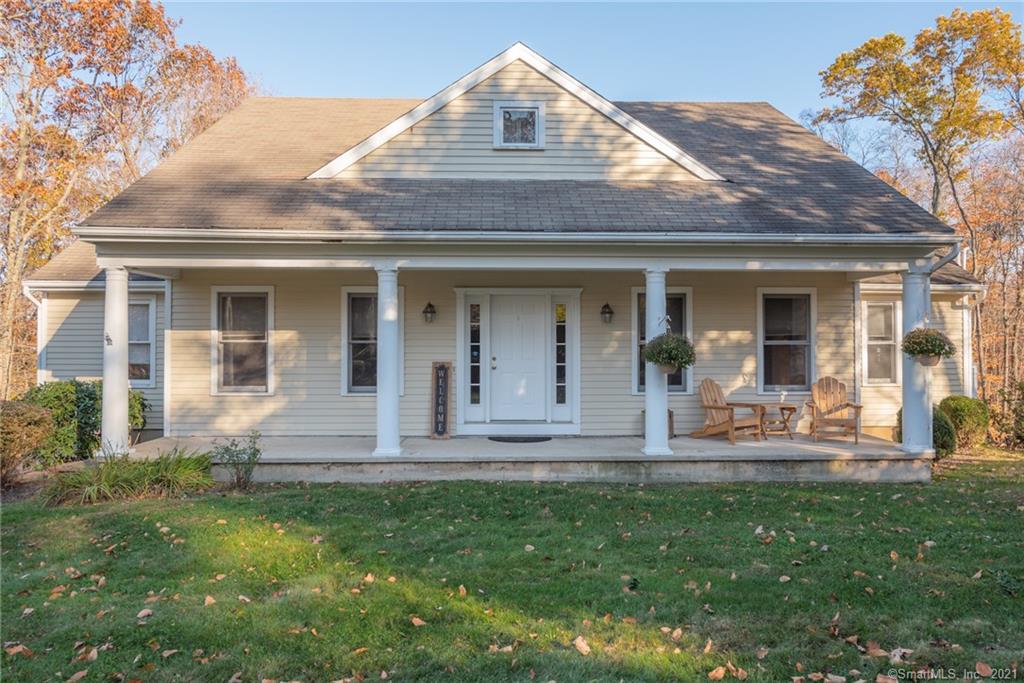 Perfectly situated near the end of a neighborhood cul-de-sac in a desirable setting-this classic Connecticut colonial/cape style home welcomes all victors with a charming front porch and nicely landscaped grounds. Upon entry one immediately notices the gleaming hardwood floors that traverse the main level and guide you to the formal yet relaxed living and dining rooms. The open concept kitchen and family room with cozy fireplace and vaulted ceilings create a wonderful space to entertain family and friends alike. The main level owner's suite with well-appointed full bathroom, walk-in closet and sitting area is the perfect respite at the end of a long day. Three generously sized bedrooms with large closets and another light and bright full bathroom await on the upper level. The walk-out lower level await your finishing touches. Large rear deck looks out upon the gently sloping and private backyard. Wonderful location, great pride of ownership and ready for its next owner!