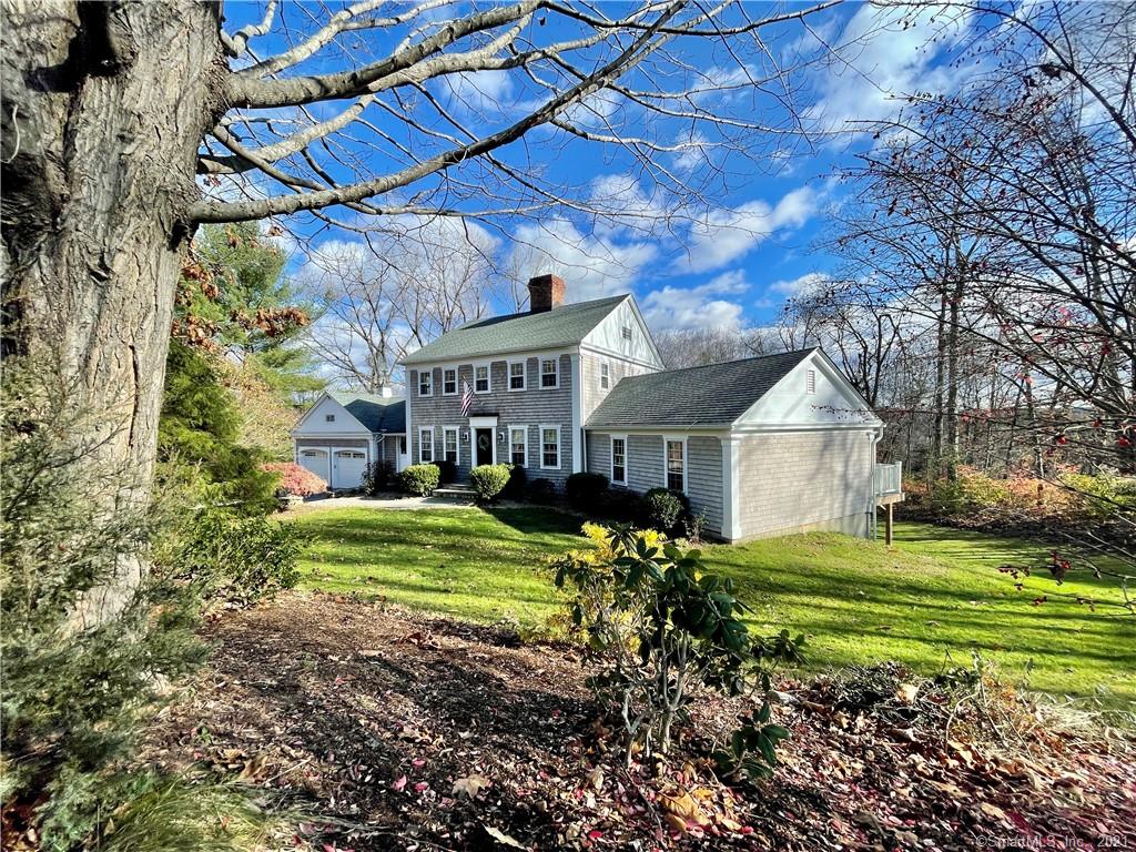 Welcome Home to 59 Davids Hill Road. This beautiful cedar shake colonial sits in a great location at the end of the cul-de-sac just off Flanders Rd in Litchfield County. There is great flow throughout this home with FIRST FLOOR LIVING if needed! This open concept layout offers living room with fireplace, dining and kitchen all open and available to entertain. The large en-suite Master bedroom has french doors to a new composite deck to enjoy your morning coffee. Formal dining and a nice large foyer lead up to the paneled staircase and the second floor. Three bedrooms, one with a window nook all have ample closet space and brand new carpeting. A gorgeous fully remodeled bathroom finishes off the second floor. The list of upgrades is long covering most of the large ticket items, i.e. roof, gutters, furnace and central air (2014) Water heater (2016) Siding and paint (2020) and much more. Woodbury has so much to offer and was just listed as one of the most quaint towns in the U.S. Enjoy shopping, award winning restaurants, close proximity to major highways and 1.5 hours to NYC.