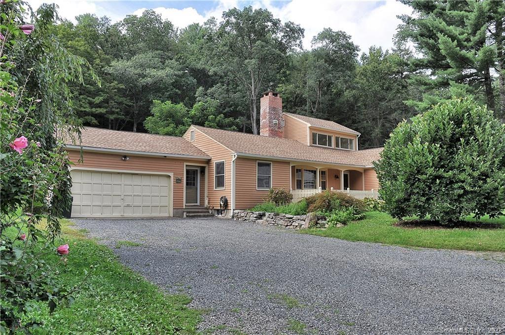 Beautiful expanded ranch style home on a quiet country lane close to town center and Orenaug Park Preserve. This unique home offers one level living, if desired. An open concept kitchen with floor to ceiling fireplace, custom handmade tile backsplash and commercial grade gas stove that offers ample space to entertain and enjoy. The hall off the kitchen offers a den / office space and guides you to the garage, laundry and powder room and a HUGE family room with vaulted and beamed ceilings with one of 3 fireplaces in the house and radiant floor heating from a hydronic wood boiler. The fireplace is flanked with a natural fieldstone and a large beautiful mantle. Towards the front of the home the formal living room has a huge picture window to let in the light and offers built-in's, and an additional fireplace to keep you toasty warm in the winter and beautiful hardwood floors. Just beyond are two bedrooms (one which could be the master) and full bath all with hardwood floors. The second floor offers a very private Master Bedroom retreat or large bedroom with walls of windows to take in the view of nature and, this room, although used as a bedroom does not offer traditional closet space. Outside the home there is a fieldstone patio with fire pit area, a garden shed that has endless possibilities and a wood burning furnace to reduce your oil bill!! This home is in a great location, hiking trails, walk to local restaurants, shops and shopping. 1.5 hours to NYC