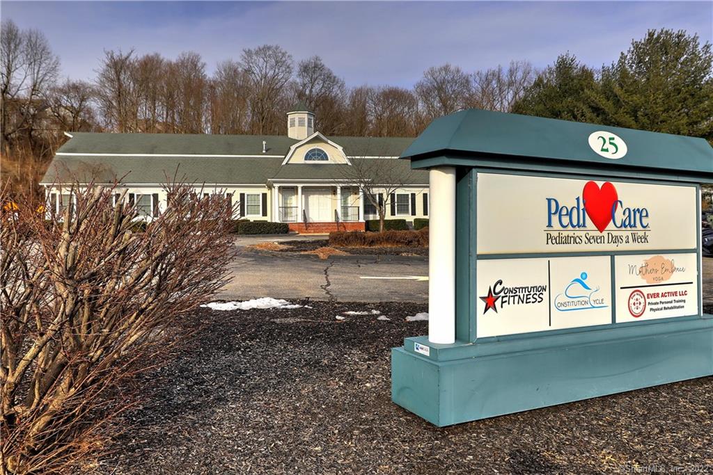 Office space for lease in Shelton, CT - Minutes to the Merritt Parkway and within walking distance to commuter bus line. Situated on 2.84 acres in a Planned Development District bordering River Road. With 4, 960 SF of office space available on the lower level; Large pediatric practice occupies entire first floor with long lease in place. 25 Constitution Blvd S features: central air-conditioning, passenger elevator, generator, a wet sprinkler system, security alarm system, 7 bathrooms, and is fully handicap accessible. There is street-level parking on both sides of the building, with 40 shared spaces and 8 designated spaces. The building has a ceiling height of 8' in the main and lower level and heavy power (1600 amps). Prior use included physical therapy practice, orthopedic practice, and MRI services. The lower level has a reinforced space 17' x 18' that can accommodate MRI/XRAY equipment.Easily accessible to River Road, Route 8.