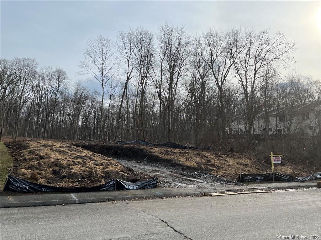 LOT CLEARED! APPROVED 12 UNIT LOT IN ONE OF THE BEST NEIGHBORHOOD'S IN WATERBURY. SITS BETWEEN 83 & 101 TAFT POINTE, BOTH OF WHICH ARE ESTABLISHED, WELL-MAINTAINED BUILDINGS. REAR BOUNDRY OF SITE ABUTS HOP BROOK STATE FOREST; LIKE LIVING IN THE COUNTRY, BUT CLOSE TO EVERYTHING & ACCESSIBLE TO 84 & 8. BEST SITE ON STREET. CONDO MARKET SEVERELY DEPLETED. NO OTHER PROPERTY FOR HIGH-END CONDOS AVAILABLE. BRAND NEW UNITS WILL SELL FOR SIGNIFICANTLY MORE. PLOT PLAN, BUILDING PLANS & WETLAND APPROVAL IN PLACE. SUPPLY IS LOW! TIME TO ACT IS NOW!  COULD BE BUILT/TAXED AS A 12 UNIT APARTMENT BUILDING. OWNER /BROKER.