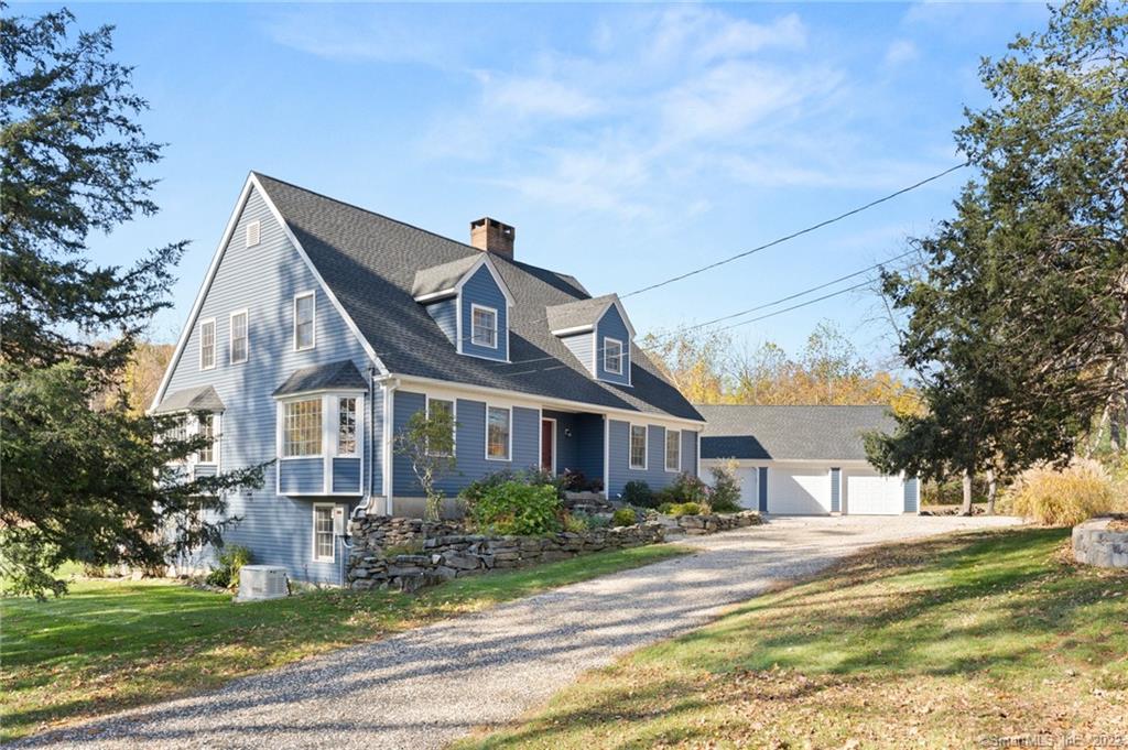 The Quintessential Connecticut Cape, perfected! Pride of ownership is the leading attribute at this picture-perfect 4BR with main floor primary suite. A home in every sense, the floor plan works so well for full-time or weekend residency. Awash in calming gray tones, the main floor has a formal living room, formal dining room, family room/den (with FP), a gorgeous renovated kitchen and an adjoining great room with another fireplace. The kitchen has been beautifully updated including new stainless appliances perfect for dinners at home. The primary suite is tucked away on the main floor and is so spacious, including a huge bathroom and walk-in closet. Upstairs, three additional bedrooms and full bath. The laundry center is on the main level along a spacious gallery between the great room and the incredibly spacious 3-car garage for cars, hobby vehicles, home gym, workshop - who knows!? The lower level is currently unfinished and over 2, 000SF of space with high ceilings, new french doors to the backyard and a garage door for lawn equipment. There is an antique barn on the grounds as well as a wide open lawn. A long list of recent updates include new roof, generator, new well pump and well tank, freshly repainted interiors and more (ask for complete list). Located in bucolic, historic Woodbury just over the line from Roxbury. This is that perfect package that doesn't come along often - a gorgeous home that is move-in ready.