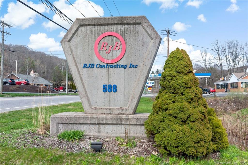 This property sits on 3.406 + acres located on the east side of Winsted Rd (old Route 8). The site has a one story light industrial building of masonry and steel construction which was constructed in 1972 as Grossman's Lumber Yard. It was renovated by its current owners in 1997-98. The gross building area is estimated to contain 14, 640 SF. The building itself contains about 4, 636 sf (32%) of very good office space, The office has hot air and A/C through ceiling duct system with ceiling height of 10 feet and the shop has ceiling hung hot air units with ceiling height of 19 feet. All new LED lighting throughout. The property also includes Two, 3 sided wood frame, metal-sided and roofed storage sheds comprising of 1, 350 SF and 2, 070 SF located on the north and southeast side of the main building. The building is currently occupied by a concrete contractor. (The building and land are for sale only.)