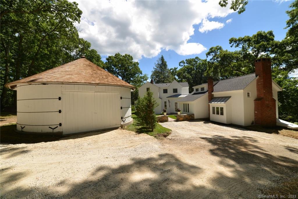 This renovated gem is in the bucolic Painter Hill district of Roxbury near Washington CT. The photos don't do it justice! This is a must see property full of character, privacy and seasonal views! All of the needed updates are done! Imagine entering the home through a sunlit vestibule. To the right there is an impeccable entertaining room with a lofty barn wood trussed cathedral ceiling. To the left is a ideal daily living layout with an open dining, living room and fully renovated gourmet kitchen well appointed with new Dacor appliances and quartz countertops. The second floor Primary suite is luxurious with a cathedral ceiling, walk in closets and new bath with large soaking tub and walk in shower. Relax on a large West facing renovated brick terrace with captivating seasonal views. The first floor has a versatile layout with three flex rooms, which could accommodate a first floor bedroom suite, separate offices and a gym, or suit to your use. The large one car garage is detached. Town approvals exist for a future two car attached garage and tree clearing for a possible pool area. We have estimates for the pool and the garage.