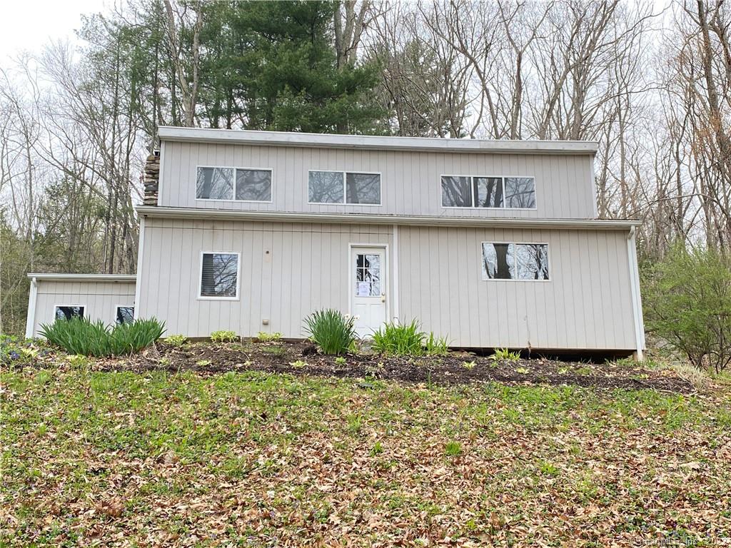 Quiet and private contemporary home located North of RT 67 near to Transylvania Pond and Radey Pond. Perfect get-away or condo-alternative. Large natural stone fireplace is a central feature in the great living room. Home office/den setup, cathedral ceiling in living and dining room, open floor plan. Great yard for gardening and entertaining. Stately stone walls appear in yard and offer sitting areas and natural barriers. Some TLC will make this shine! Bring your ideas and offer today :-)