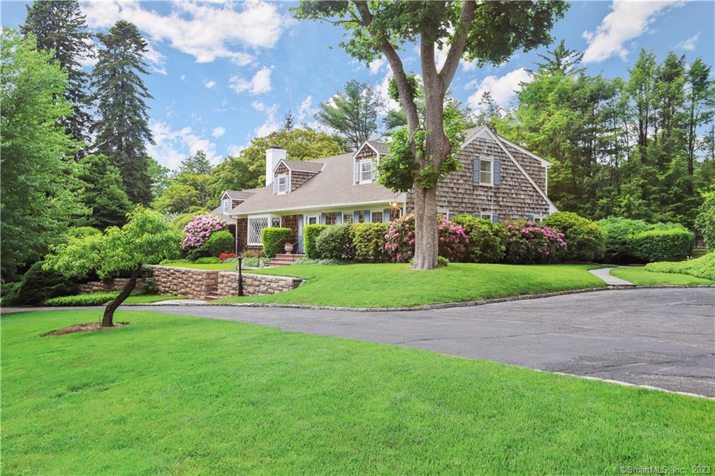 Spectacular, magazine -ready, verdant grounds on 2.39 acres with heated pool and mature specimen trees. Located on North Street just minutes to town, this fabulous 4 bedroom 4.5 bath Colonial ranch has exceptional curb appeal and an be expanded according to FAR. Elegant entry gates gracious stone walls and flowering shrubbery further enhance and introduce you to this home, hug windows bring this outside scenery and sparkling sunshine into every room of the house. House features gleaming hardwood floors, crown moldings, recessed lighting, interior French doors. Extra spacious rooms include living room with bay window, fire place. Formal dining room, convenient home office with built-ins, and family room. Chef's kitchen has granite countertops, island, breakfast area, high-end appliances, and copper accents. Second floor has 3 large bedrooms. Basement area is additional 1, 897 SqFt. Enjoy Greenwich's , beaches, parks, and bistros an boutiques on famous Greenwich Ave.