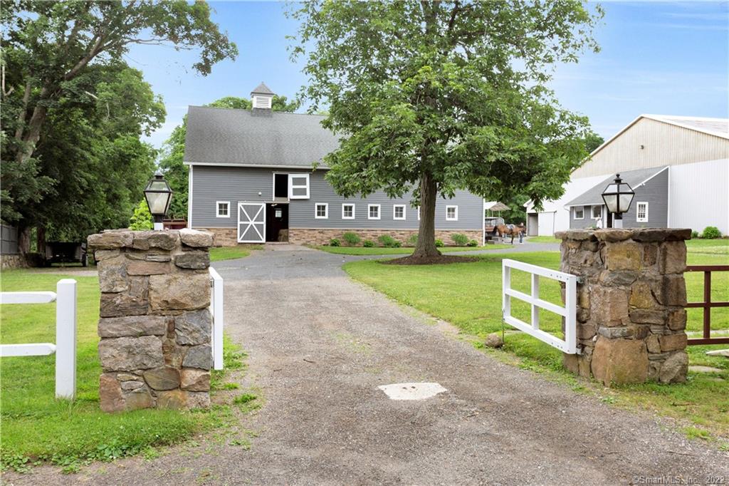 NEW TO THE MARKET- 15+ acre working horse farm in the heart of Ridgefield: 24 stalls, Large Indoor & Outdoor riding rings w/custom footing, 9 paddocks and new fencing. Gorgeous grass fields for riding, additional turn-out or potential house site. Staff housing in two separate structures. Minutes to top North Salem horse show venue with its bucolic trail system and minutes to town. Includes everything a rider/trainer/owner could need for an income producing horse farm with a waiting list! 'Year built' varies for the different structures. All buyers must be qualified. Need minimum 24 hour notice to show.