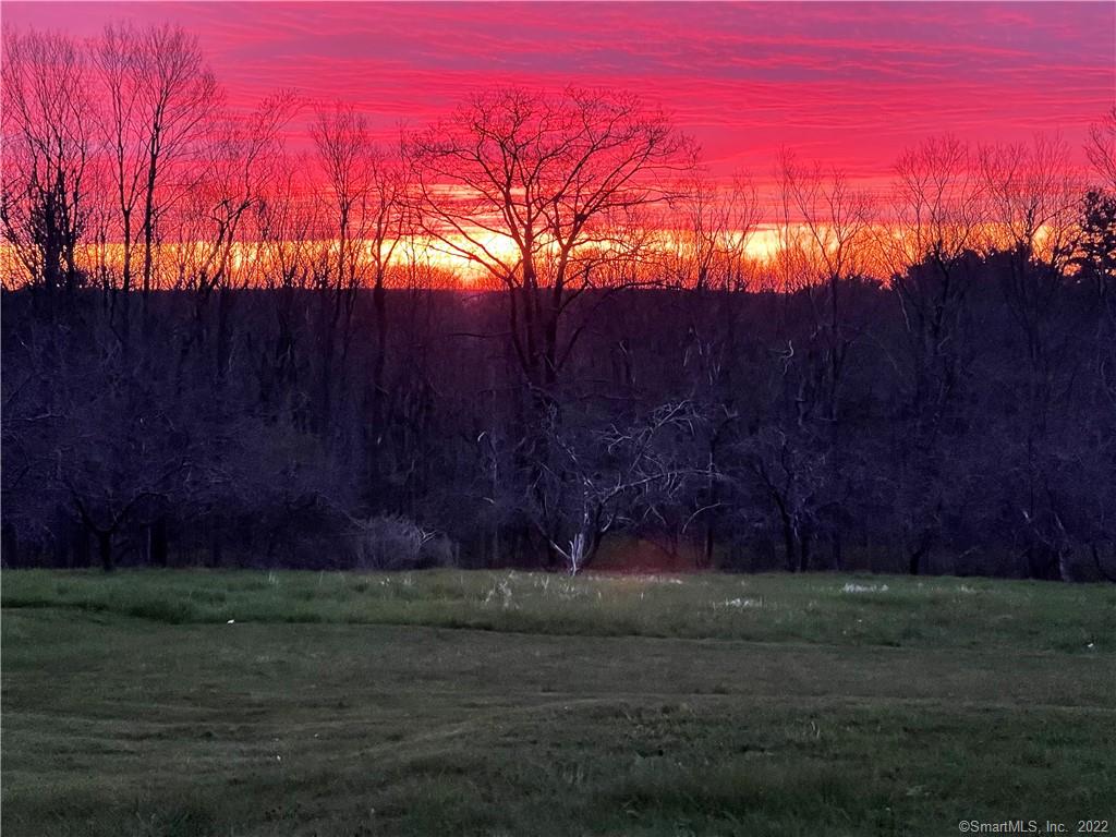 Spectacular sunrises, amazing sunsets. DISTANT VIEWS, open meadows, woodlands, stone walls, rolling hills, an apple orchard, TOTAL PRIVACY. Country living at its best ~ NO time to be bored with land as diversified as this! This surveyed property is a potential gentleman's farm with vintage farmhouse and barn/outbuildings on 87 acres of land in Barkhamsted, Litchfield County. Possible subdivide. Currently zoned for residential and business use. EZ drive to Springfield, Hartford and Bradley International Airport. Biking, hiking, skiing, canoeing and kayaking just a stone's throw away. A beautiful plot just waiting for your dream house!