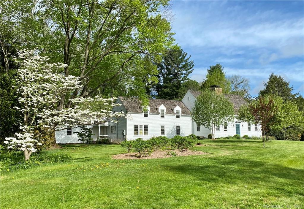 Four Seasons: This Woodbury home is located on a quiet street off the town center. Beautiful vintage interior appointments including 6 working fireplaces, chestnut/oak floors and 8 foot ceilings are quintessential to this home that has evolved throughout time. Perfect for entertaining in all seasons, the interior has a circular flow while multiple doors open to the outdoor covered stone patios with a view of the expansive lawn, meadow, and floweredgardens. 3 bedrooms and, in a separate wing, Guest Bedroom, with full bath with its own beautiful living room with fireplace and separate entrance. Lots of closets and storage cabinets throughout the home. Beautiful updates. Ready to move in and enjoy every aspect of country living. The lower level with field stone walls has a pool table room, wine cellar and craft room. Complete privacy across from conservation land. The total 7.9 acres of land is comprised of 4.43 acres with the main house and 3.47 acre separate building lot which has been put in open space for lower taxes- reflected in the data on this listing. The grounds are manicured with mature specimen trees, vegetable and perennial flower gardens. There is an attached two car garage with partially finished space above, a remarkable free standing 3 car post and beam barn, newly renovated 40x15 permitted home office in a separate building, garden shed, heated Scott Pool, lighted tennis court/ basketball court. For more: themeadow is where you can continue your dream. .