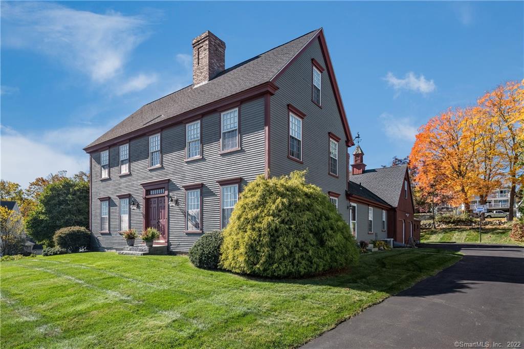 Historical & architectural appeal and this home is also walking distance to historical downtown Mystic and the 100 year old bascule bridge. 5 bedroom 3 1/2 bath home located on one of most beautiful street in Mystic. Kitchen and family room are open to each other with a fireplace and then a separate dining room.  A lovely living room with a fireplace and French doors opening to a ingound pool and patio. Great for entertaining! Three bedrooms on the 2nd floor including the primary suite with walk in closets and full bath. Two bedrooms on the 3rd floor with a full bath. All through the house beautiful wide pine floors. This home has been lovingly taken care of with inground pool, lovely gardens and an attached two car garage with a bonus room above. Easy walk to town which is very desirable and even closer is the Mystic & Noank Library.