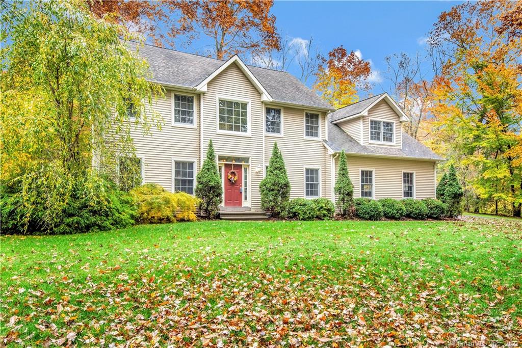 Wonderful center hall colonial ideally located in Southern Woodbury for quick access to major routes and a short drive to Woodbury historic downtown! The main level provides a generous sized eat in kitchen opening up to fabulous family room with cathedral ceiling, hardwood floors, and masonry brick fireplace. A formal dining room, living room and office, all with hardwood floors, round out the first floor. The upper level includes three good sized bedrooms, and a primary suite with hardwood floors, a vaulted ceiling, walk in closet, and full bath. Located on a 2.45 private acres, this home is barely visible from the road. Priced to sell, this home offers a two car attached garage with a second stairway to the basement, plenty of yard space to picnic, and a stone patio located just off the kitchen/great room.