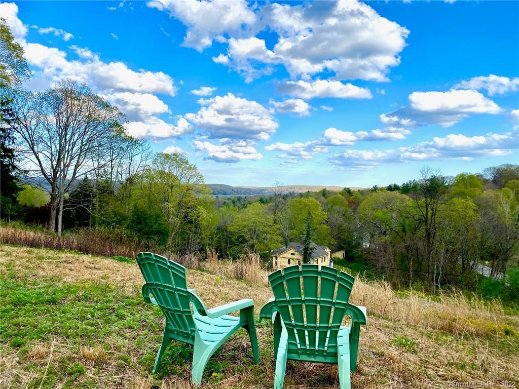 1.5+ acre lot, clear cut, open, sunny, with a clean air flow. SE facing with 4-mile view down CT River Valley to Deep River, and Lyme Hills; seasonal partial view of Gillette Castle in Hadlyme. Excellent solar, passive or active potential; 220 volts available at street. Ready to build with approvals in place for 3-bedroom septic, town building department, with Connecticut Water Co. supply line available at the street. Well-engineered and installed driveway roughed in with stone base from street level to elevation at top; highly engineered drainage system adjacent to driveway from top to bottom connected to town road storm drain. No wetlands, no water crossings, no shared access, no intrusive noise. Less than a mile walking via country roads to downtown Chester, and to historic Chester-Hadlyme Ferry. Not a development; no covenants or restrictions specific to lot. House placement can allow for expansive parking/freestanding garage/large barn, and for safe rear and side yards. Drone footage available https://youtu.be/Ks6ut-XOkng