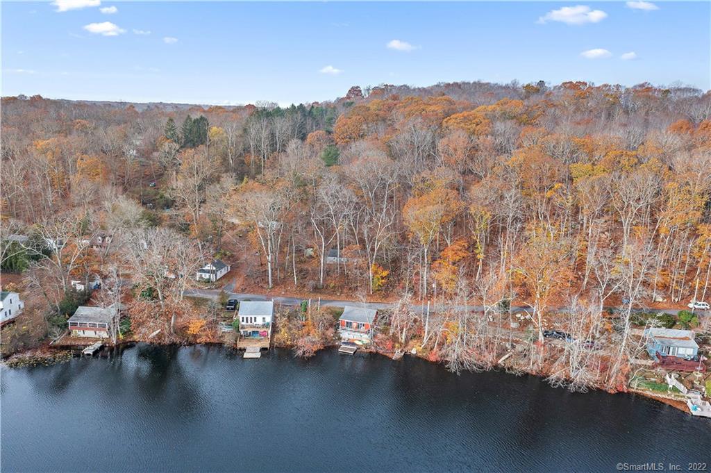 Why rent when you can own?! Be a lake house owner! House needs a lot of love and the price reflects that! Gorgeous BREATH TAKING lake view. Sloping lot. Beach rights, convenient to Foxwoods and shopping. Possible great investment for short term rental. Over 1/2 acre lot!! CASH OR 203K ONLY SUBJECT TO PROBATE APPROVAL, MOST PROBATE COMPLETE. Buyer/buyer agent responsible for due diligence.