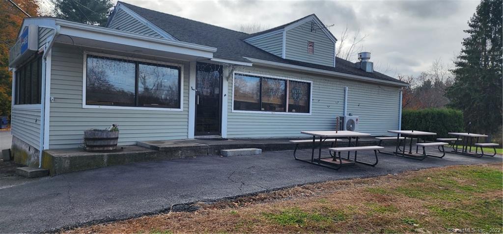 Fantastic Long-Established Business Location. Rare Opportunity. Restaurant Circa 1984. New Roof 4/28/24. Prime Location & High Traffic Count on Main Route 6 Road. Ample Paved Parking for 22 vehicles. Current Lease is $2668.79/mth and Increases $50 Per Year. Tenant Business and Business Name Is NOT Included. Property Has Private Well & City Sewer Connected. Address of 109 Hartford Rd, RT 6, includes Restaurant Building on .62 acres. Seller Financing Available. Terms and Conditions Apply. All Maps Included Noting Potential Buildable Lot on Harris Ave Allowing for a Duplex to the Rear of Parking Lot. Original Subdivision Map Includes 2 Duplexes, This Would Take Away from the Current Parking Area. If the Buyers Intentions are to Build, a New Survey Would Be Needed for this Back Lot at Buyers Responsibility. Property to be sold AS IS. PLEASE DO NOT CONTACT CURRENT TENANT FOR LISTING INFORMATION.