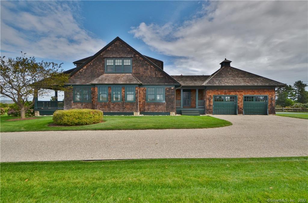 This traditional Fenwick cedar shingle style home has spectacular water views of the Connecticut River and South Cove. It also enjoys Fenwick's unique lifestyle: beach, tennis courts, Yacht Club and famed golf course. The 2, 634 home built in 2006 with the highest craftsmanship and state-of-the-art materials has wide board floors throughout. The great room with a coffered ceiling has a wall of windows above the long banquette, a large beach stone fireplace and built-in cabinets. French doors on the lower level open to a full width porch, which overlook the long water views and beautiful professionally landscaped gardens. The open kitchen is flooded with sunlight and is a chef's delight with all top of the line appliances. Rich mahogany cabinetry and marble counters and sit down island are custom made. The first floor 15x15 master suite has built-ins, and has access to the porch. A guest room/office off the kitchen has a bead board ceiling, shiplap walls, and state-of-the-art Murphy bed built into custom cabinetry. Mudroom side entrance with outdoor shower, includes extra built-in cabinets, farm sink and washer/dryer. Two guest rooms on the second level, one with built-in beds have access to the balcony with views of the hydrangea border gardens and water. This beautiful dream home sits on a private .46 acre parcel and has full mechanicals including a full house generator. Located half way between New York and Boston and is only minutes to all major transportation.