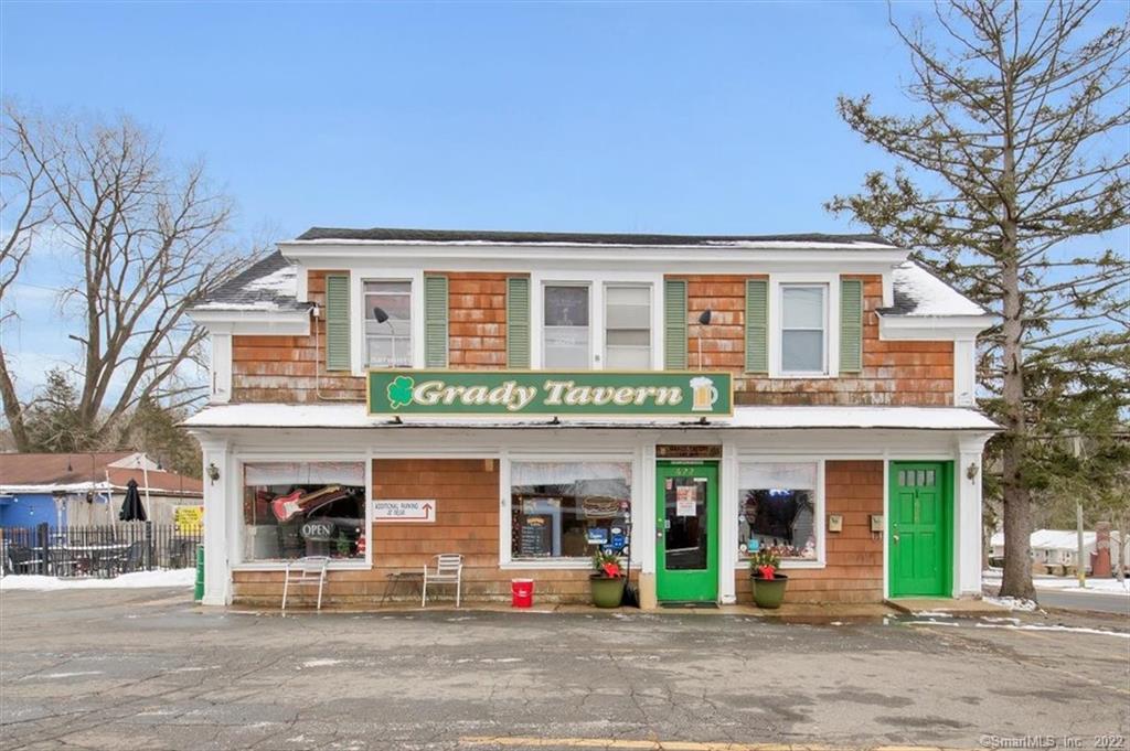 Investment opportunity located in prime Manchester location. Freestanding building currently being used as a Tavern with 3 bedroom apartment on upper level. Tavern floor consists of 1, 036 sq ft including 2 bathrooms, kitchen, open bar area, large walk-in cooler, office, patio and parking on premises. Roof 10 years old, gas furnace 4 years old. Upper apartment consists of 777 sq ft, 3 good sized bedrooms, living room, kitchen and 3 season porch. Gas utilities, newer roof, plenty of parking, make this property open to an unlimited amount of possibilities!!