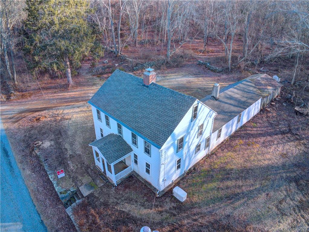 Circa 1750 Colonial home on 37.37 acres. Frontage on three roads. Beautiful land with a large field on Windham Rd and Reilly Rd the land is separated by Little Brook. Tons of stone walls and flat open land. The house needs love. Take some tome and bring this home back to it's original beauty. Large fireplace in the kitchen and one in the living room. Full walk up attic. Large Ell with an attached 1 car garage and 2 car carriage shed. Can be subdivided or make it your family compound. House also has a gererac generator that runs on propane.