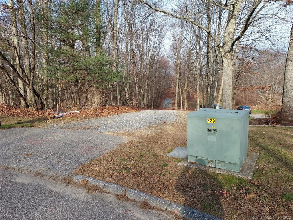 Country Set 4.34 Acre Treed Rear Lot Situated at the End of Permanent Cul-de-sac Neighborhood Street! Approved Building Lot with Advanced Development Status that Includes Driveway Installed to House Site, Underground Utilities Installed, Drilled Well In-Place, and General House Site Area Cleared! Excellent Location Offering About Equi-Distance Commute to Either Hartford and Norwich-New London Areas Via Commuter Friendly CT RT 2. Lot Available for Sale to Those with a Builder Already in Mind or Those with a HOUSE PLAN and NO BUILDER Offered Potential of Owner Associated Builder Willing to Custom Build for You!