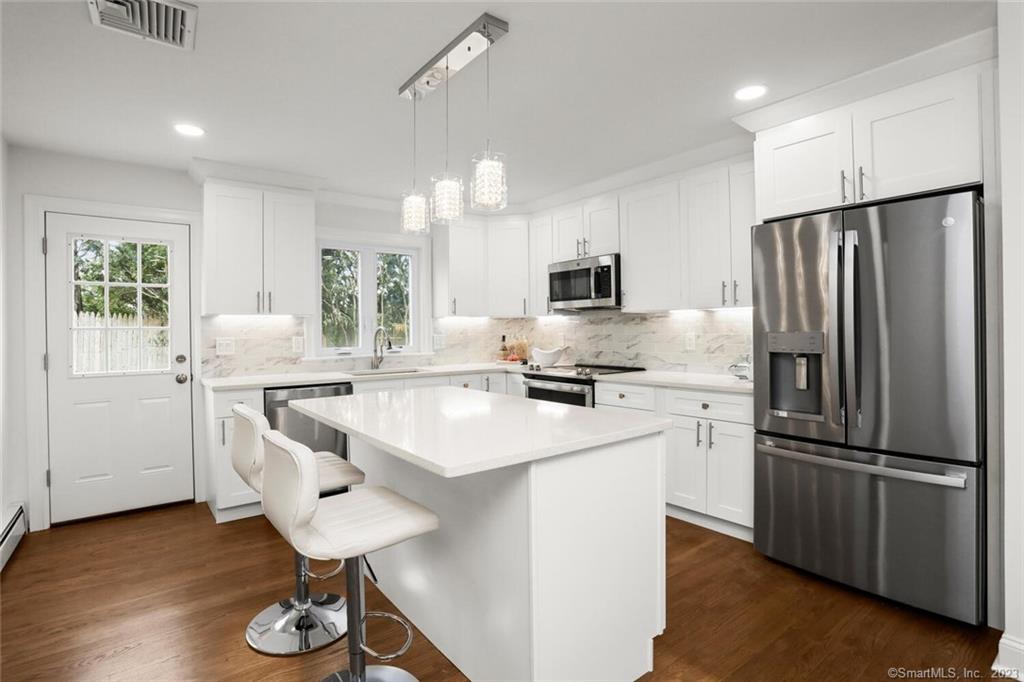 Unbelievable value in the heart of Cos Cob. A hop, skip and jump to schools, parks, shops, eateries and Metro North. Completely renovated in 2022, sun-filled 4 bed, 2.5 bath home boasting new kitchen and baths, exhibits turn-key finishes from top to bottom. An additional 1, 000 SqFt. of living space in lower level is perfect setting for a home gym, office, or game room. Outside is a bluestone terrace and expansive lawns with a potential pool site. Exterior & mechanical improvements include new siding, new windows and new furnace.