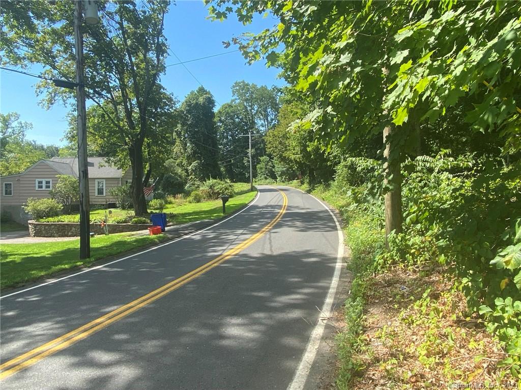 Beautiful 1.77 acres set on winding country road on Cheshire line. Build your dream home and watch the sunrise from the knoll, with beautiful views overlooking acres of wooded privacy. Backyard area was formerly a pasture and large vegetable gardens. Classic New England stone walls along the front and throughout the property. The area retains the feel of its rural roots, yet is minutes to Interstate 84 as well as sports fields, playground, and Prospect's beautiful, modern elementary school. Do not walk property without notifying listing agent. Owner related to listing agent.