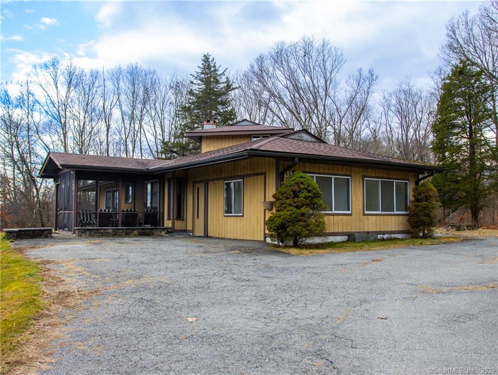 First time on the market. It's all about location. Putnam-Dutchess Line. Not only is it quiet, peaceful and private  you're only minutes from I84 and Metro North. Perfect for commuters! This home is nestled up and away from it all. Relax in your screened in porch that overlooks the well-maintained lawn. When the leaves fall, you have a bird's eye view of Thunder Ridge. This single level sprawling Ranch has 6 sets of SGDs, 3 Bedrooms, 3 Full Baths, Living Room w/ 3 SGDS looking outside and a decorative fireplace. One loft room upstairs. Living room, primary bedroom w/bath, dressing area, additional bedroom, and laundry. In law suite w/bathroom, bedroom and sitting room. 1762 sq. ft. of living space and all this on 9.45 acres.