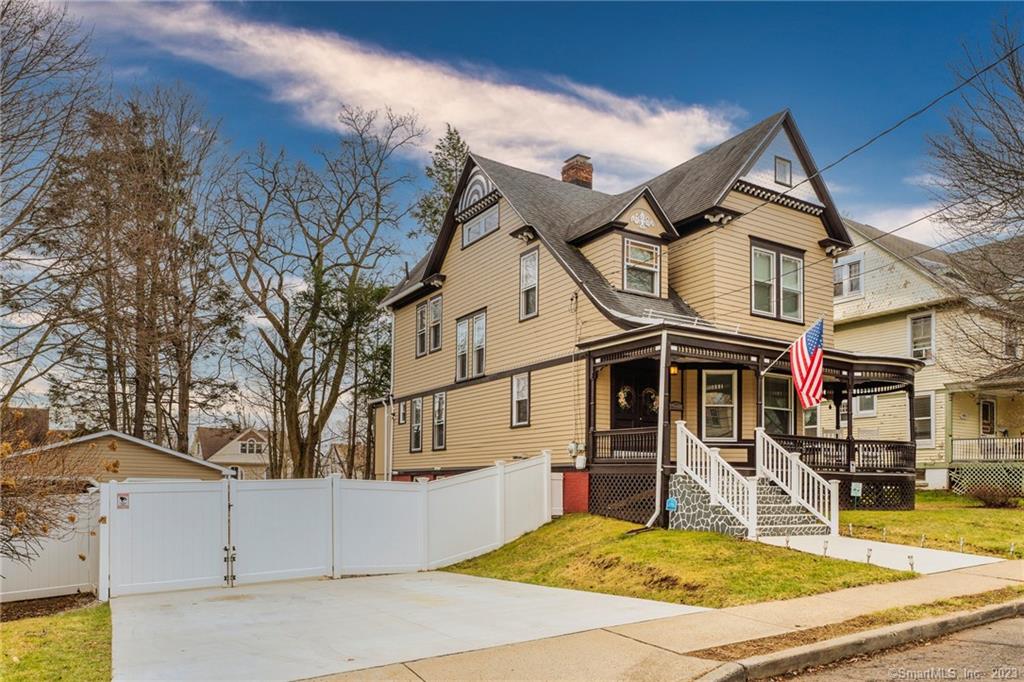 Totally renovated and freshly painted colonial home with 7 full bedrooms and 2.5 baths including master bedroom suite, partially finished basement and 2 car detached garages. Gleaming hardwood floors and ceramic floor tiles. As you approach the entry, there is a large covered wrap around porch. Entry is gained through double doors which leads to a foyer with ornate decorative wooden stairs leading to a huge landing and bedroom wing. The entry foyer leads to the formal sitting, living and formal dining room and also the renovated kitchen with stainless steel appliances and newer cabinets and granite counter tops.The ornate carved wooden staircase leads to the 2nd floor.This floor has master-bedroom suite and 3 other bedrooms and a fully equipped movie room with projector, surround sound, display screen, sound system and theatre seating.From the 2nd floor landing the stairs continues to the 3rd floor which has 3 bedrooms.Lots of outdoor space and amenities for recreational activities,  Many major upgrades including, all new windows, complete interior and exterior painting, double driveway and new 2 car garage, 6 feet high white privacy vinyl fence, concrete backyard patio with metal gazebo and 2 wooden sheds. security cameras.all furniture negotiable!