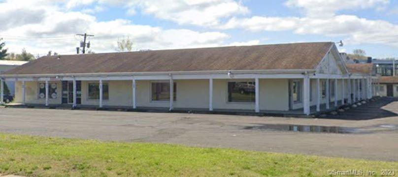 1.38 Acres of Level Land on Automobile Row in North Haven near Exit 13 off I-91. This motel and retail building have existing income or raze both buildings and build a new Hotel or Automobile Dealership. Broad zoning permits a variety of uses.