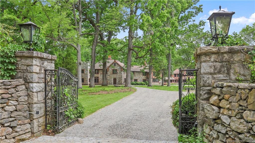Dramatic & inspiring, this 1920's stone & brick Family Compound in Westport's Premier Old Hill Estate Area neighborhood achieves the perfect balance of old world charm, intimacy, and opulence with distinctive custom millwork and modern expensive upgrades throughout. Tucked behind tall privacy stonewalls and iron gates on a beautifully manicured and professionally landscaped 3 acres w/heated gunite pool and recently resurfaced tennis/sports court, 50 Sylvan Rd N is the epitome of fine living. Nearly 11, 000sf which includes 6 bedrooms in the main house & 3 bdrms in the guest wing over the pool cabana, you'll fall in love with the unrivaled personality & excitement at every turn: oversized public rooms with high ceilings; beams; 9 fireplaces; big windows & french doors; gourmet kitchen with cozy fireplace & French doors that open to the back patio and courtyard for al fresco dining; impressive master suite with soaring ceilings & sitting room w/fplc. Ideal for today's hybrid or work-from-home lifestyle, there are 2+ offices & 500sf+ above the 3-car garage. Other special features include pool cabana w/kitchenette, changing rooms, full bath & laundry; multiple patios for large scale entertaining; & tennis court/sports court with fun viewing party hut. Just minutes to shops, downtown, Westport's delicious restaurants, gorgeous beaches, train & highways.