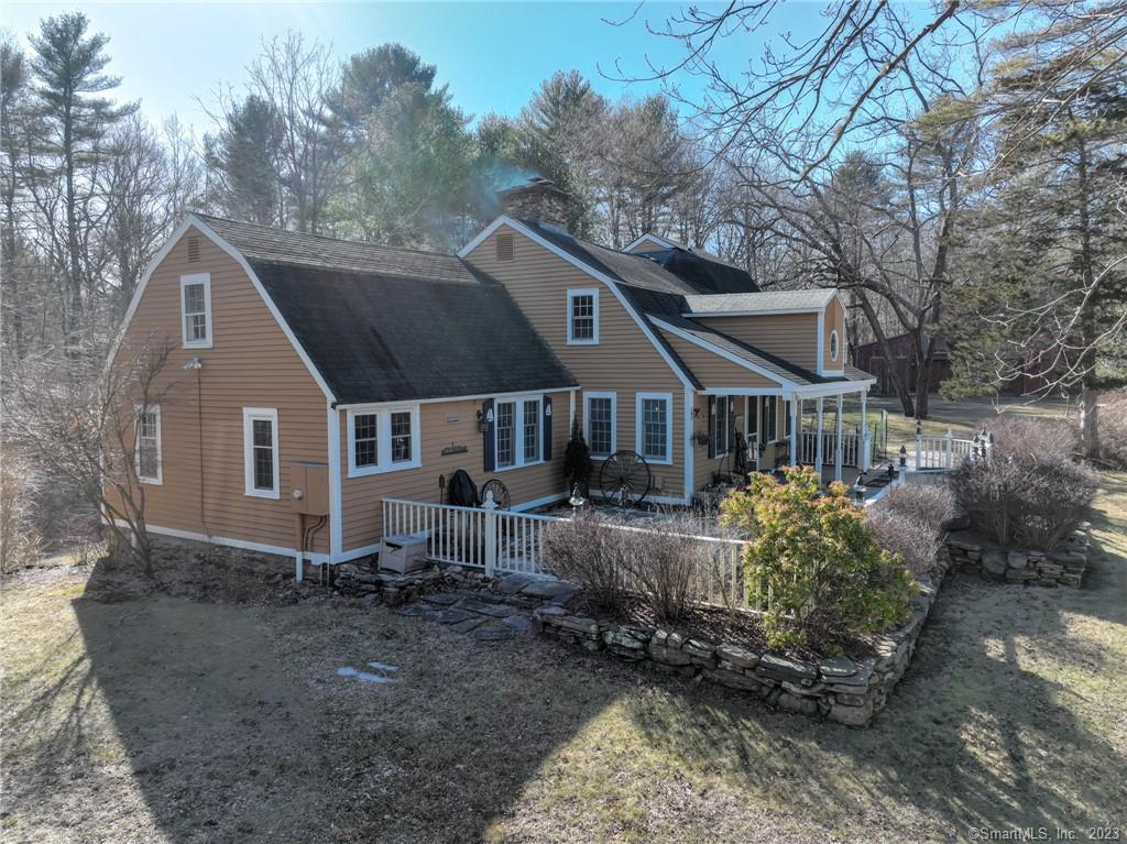 The Philip Gray Jr Homestead built in 1765 is now available. It is a Gambrel Cape with five fireplaces and wonderful wideboard floors set privately on 9.11 Acres just two miles from Foxwoods Casino. There is a detached barn with room for three or more cars, two stalls for horses, a tack room and a walkup attic built in 2003. The house has a charming feel when you sit by one of the five fireplaces. There is a main floor bedroom with private whirlpool bath and the primary bedroom on the second floor also has its own whirlpool bath with separate double tiled shower and a balcony overlooking the woods. The kitchen off the dining room has been renovated. The lower level is a walkout with a library that has a fireplace with woodstove and there is a family room that has been recently finished too! A large deck which is partly covered overlooks a fieldstone patio and the yard. There is updated electric with 400 Amp service.