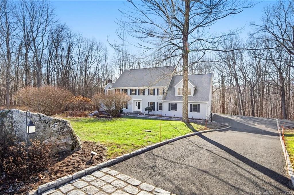 Impressive newly refreshed colonial in a sought after area of Sherman, CT. Country living at it's best with over 5, 000 sqft of living space, a home you must see in person to truly appreciate. Double height great room that connects to the beautiful eat in kitchen which also leads into a 3 seasons room, two decks, and a large patio with built in fire pit make this home perfect for entertaining in every season. This home is a great combination of traditional and modern living spaces and layout. The special bonus of this home which makes it stand out is the LEGAL one bedroom apartment with double sided fireplace in the lower level. An ideal space for extended family, rental income (long term or short term), au-pair, or what suits your needs. Has private outdoor access as well as available access through the garage and basement. This home is a great opportunity for those looking for a tranquil country setting while still being close to all the amenities Sherman, CT has to offer. Close to train, Lakes, schools, shops, parks, ski, and more. 70 miles to NYC.