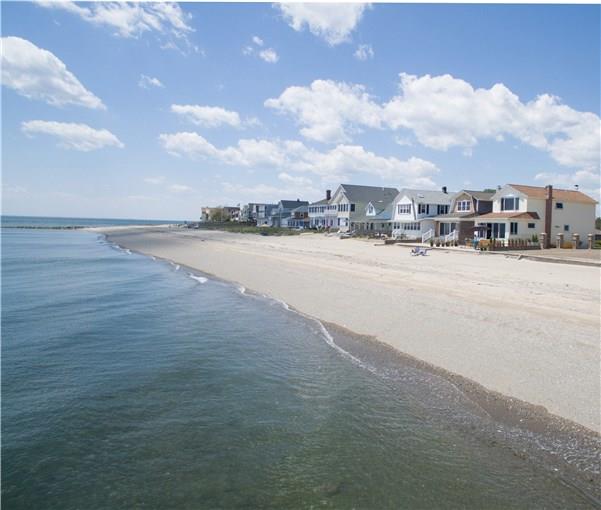 Live your dream at the water's edge. The 'Tackle Box' is the perfect seaside retreat. The thoughtful design and open floor plan takes advantage of the serene waterfront setting. The sliding glass doors across the back gives you incredible views of long sandy beaches , stone jetties and forever views across the water. Awake to the sights and sounds of the water from a spacious primary bedroom with cathedral ceiling, picture window overlooking Long Island Sound, and a wall of custom closets. The bath has a soaking tub, large step-in shower and views to the water. This is turn key, low maintenance, a fabulous investment property. Step out the patio door and take long walks on the beach...swim ....fish...kayak or just watch the sunsets. A perfect escape in all seasons!Listing shows owners furniture in all photos not the tenants.