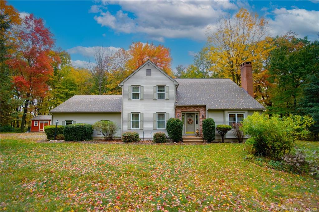 Sitting Pretty in Woodbury, Connecticut, a Litchfield County retreat. Situated on 3.38 acres, this spacious 3 bedroom, 2.5 bath home has a marvelous open floor plan, large eat in kitchen with a 5-burner cooktop and double ovens, a generous sized dining room that will certainly seat a large crowd, and a large living room with a focal point fireplace, access to the deck, and soaring ceilings. The deck and stone patio in the back add additional living space in the beautiful outdoors. There are three bedrooms upstairs, the main bedroom has an ensuite bath with double sinks, a jet tub, separate shower and walk in closet. The home has oil heat, central air, central vacuum, generator hook up, full basement with high ceilings, attached 2.5 car garage with stairs leading to a 1.5 story loft, a mix of hardwood, tile and wall to wall carpeting. The owner obtained a permit for a 3-car garage to be built on the property in 2019, if your clients need more garage space it is possible but would have to be re-permitted.