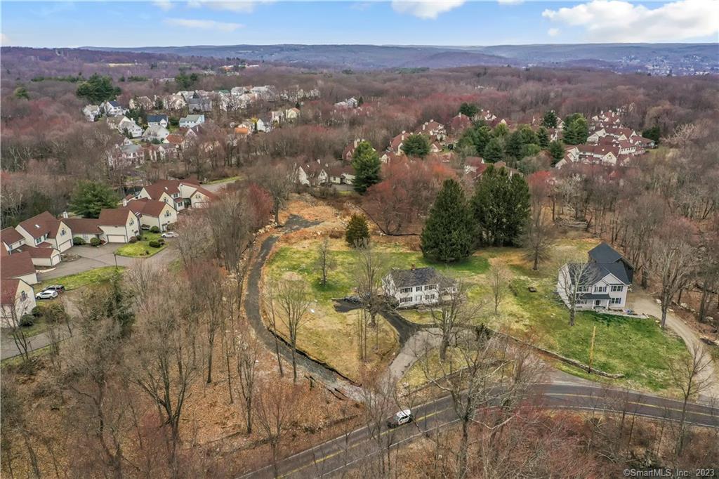 Welcome to 155 Nells Rock Rd in Shelton CT! This 1.97 acre Land is mostly cleared and ready to build your dream home. Property includes developmental and zoning permits with plans to construct a 3000sqft Colonial with 2 car attached garage and walk out basement! Lot is buildable on about 1 acre. There is a small portion of wetland on the lot. If client desires, a larger home can be constructed. Approved up to 3, 500sqft. Schedule a tour today and secure your slice in one of the most up and coming towns in Fairfield County!