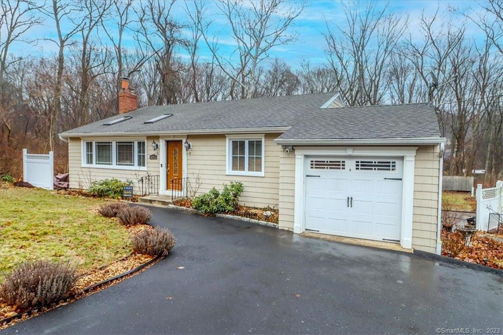 Location! Location! Ten Minutes to Metro North train and Easy Commute to I-95, Merritt Parkway and Route 25! Situated on a partially fenced-in, Level Acre in the Nichols area of Trumbull, this Recently Updated home, offers Newer Windows, Vinyl Siding, & Central Air & Heat. Recently Remodeled, Eat-In Kitchen with Granite Counters & Stainless Appliances. Step inside and the layout will surprise you! The Vaulted Living Room features a Corner, Stone Fireplace, Skylights & Ceiling Fan. In addition, there is a Main Level Bedroom. A few steps down enjoy the Warmth of the Dining Area, open to the Eat-In Kitchen, with Granite Counters & Stainless Appliances. Off the Kitchen, the Sun Room works as a Play Room with Sliders to Stone Patio & Level Backyard. Half Bath & Laundry Room are located off the Dining Areal. Upstairs, with views overlooking the living room, are Two Additional Bedrooms & Full, Updated Bath. Hardwood Floors throughout most of house. So, if you are looking for an Awesome, Level Yard for Play, Entertaining, & Gardening, and with Plenty of Room for Pets, you have found it Here! City Sewers & Natural Gas Heat! See it Today!