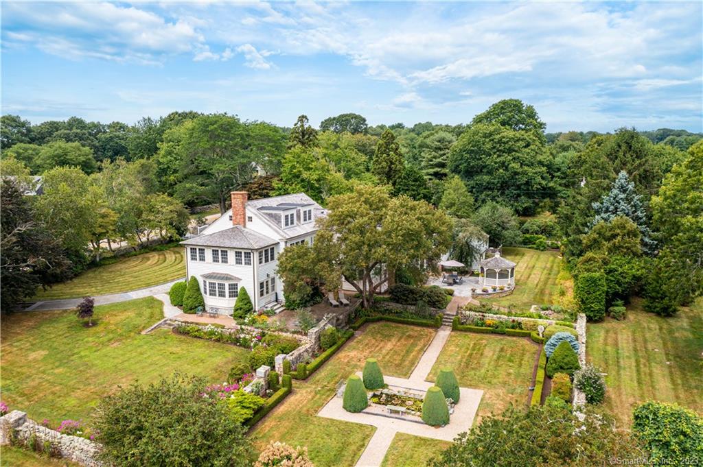 The original Findlay estate constructed in 1929. Enter through your elegant circular driveway to the front door of this stately colonial style manor. This home boasts 5, 444 sq ft of living space with 3 bedrooms and 3 1/2 baths and exquisite architectural details through out. Impeccably restored by Early New England Restorations (now known as The Cooper Group) in 2001. This amazing estate on Montauk Avenue is nestled on a 1.93 acre corner lot featuring mature specimen trees, flower gardens, cut stone hardscape and ornamental pond. The gardens were designed by Vera Findlay after whom the adjacent Findlay Way was named. Among the many outstanding features are the French Farmhouse kitchen with wide antique pine floor boards together with cherry cupboards featuring antique glass, brand new induction cook top, granite and stainless steel counters. There is a wet bar modeled on an English club bar with antique glass-fronted cupboards, stone floor, wood and granite counters, ice machine and refrigerator. The hallways have inlaid wood marquetry floors. The library is paneled with three types of maple and coffered ceiling. Early New England Restorations was also responsible for the restoration of The Avondale Farm wich won the prestigious Palladio Award for craftsmanship in 2020. In addition, they created the Maritime inspired Morgan Suite at The Ocean House (See Additional Remarks)