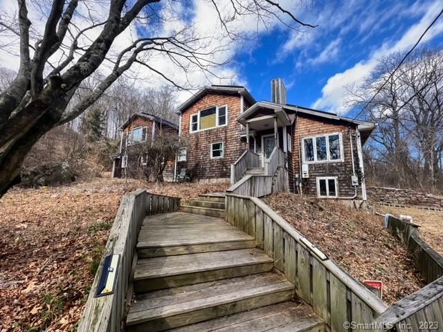 Large contemporary styled home neslted in it own private oasis. Enjoy the privacy and convince of this location, 10 minute drive from the Hamden Shopping Plazas and 8 minutes from Quinnipiac University. The high ceilings give a great open feel when you walk through the living room. The kitchen/dining room has a sliding patio door to the back deck. This property offers 4 generous sized bedrooms and 2 full baths. The primary bedroom is bright and spacious with a walk-out balcony which gives a captivating view of the properties wooded acres. This property is energy efficient with solar panels!