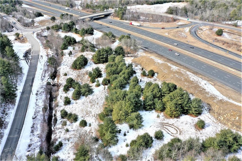 Opportunity Knocks!!! Have you been looking for the perfect place to build your business with direct access off I-84 with High visibility?  This 4.7 Acre Commercial Level, Open Land is right off of Exit 71 From I-84 East on Turnpike Rd bordering Ruby Rd in an up and coming business developing community. The property also features a flowing brook running through. Adjacent to Major Fed Ex shipping Facility, Major Truck stop TA Travel Center, The Roadway Inn, and Opposite Brand new Loves Truck stop. DOT traffic count 26, 500. Great for a Truck Repair Business, Self storage Business and more. Zoning Department open to ideas to develop this Commercial Space. Bring your own ideas, Don't Pay a lease, Come build your own Empire!