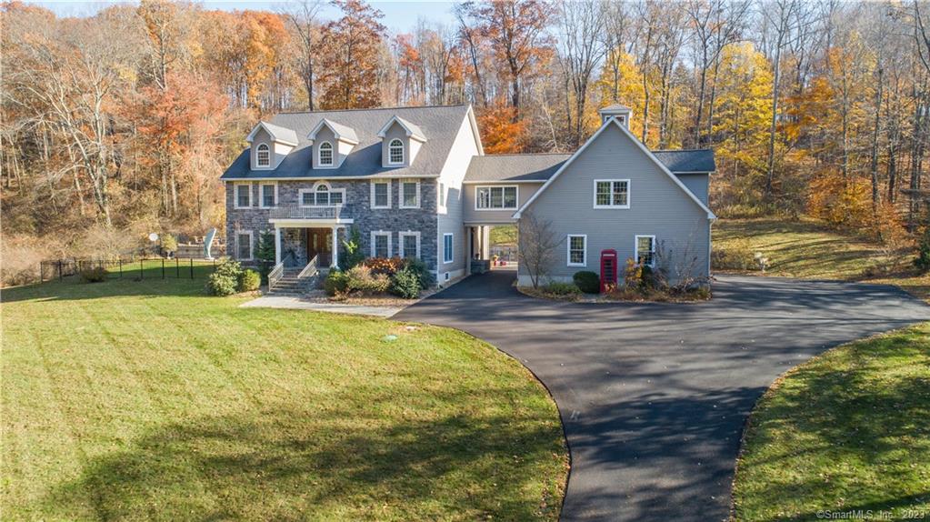 Beautiful, immaculate home is privately located on picturesque Quaker Hill. Tasteful blend of contemporary & semi-traditional design. Large, welcoming foyer & wide gallery lead to the open concept Gathering Room w/fireplace and French doors to patio. Amazing two-story glass Conservatory is fully open to the gathering room and fabulous Chef's Kitchen, which features all the bells and whistles. Wolf 6 burner Range w/grill and two ovens. Pot-filler as well. Huge island w/prep sink, ice maker, built in warming drawer & deep storage drawers. Huge Wolf refrigerator, Stainless appliances & granite. Off the kitchen is a gorgeous bar w/wine chiller, sink, Miele dishwasher, granite counters, glass front cabinets. Wonderful Dining Rm was designed for entertaining! Unbelievably cozy, the handsome Library features a Fireplace & mahogany built-ins. Upstairs is a wonderful Primary Suite! Huge BR, large walk-in closet, spacious Den or Home Office, Full Bath w/Steam Shower, Dual sink vanity w/marble counter, jetted tub. Two additional BR's, full Bath with shower & jetted tub, Sitting Rm. 2nd floor Laundry Rm. Hardwood throughout, central air, whole house generator, 400 amp service, 4 BR septic. Top-notch Security system, house, driveway, smoke & CO. 3-Gar Garage w/12' ceiling, framed Bonus Rm w/roughed in plumbing, heat/ac. Basement w/10'ceiling. Short drive to Metro-North train, Quaint Shops, Eateries, Lakeside Park w/sand beach & new pickle-ball courts. Daryl Hall's Music Club is great!